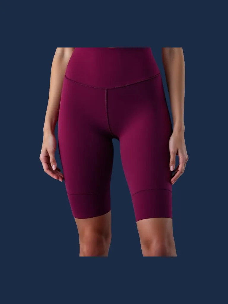 High-waisted bike short manufacturer Karachi Pakistan showing plum women's compression bike short with wide flatlock-seamed compression waistband and slim mid-thigh silhouette, performance polyester-spandex knit, front view